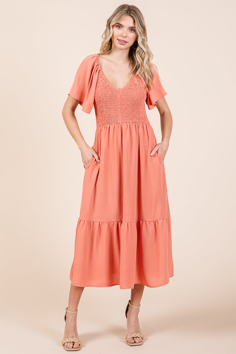 Smocked V Neck Flutter Sleeve Tiered Midi Dress by RolyPoly Apparel