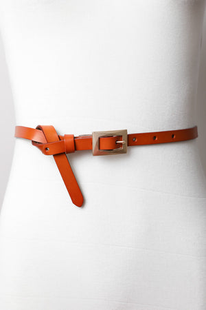 Adjustable skinny waist camel belt with sleek gold clasp.