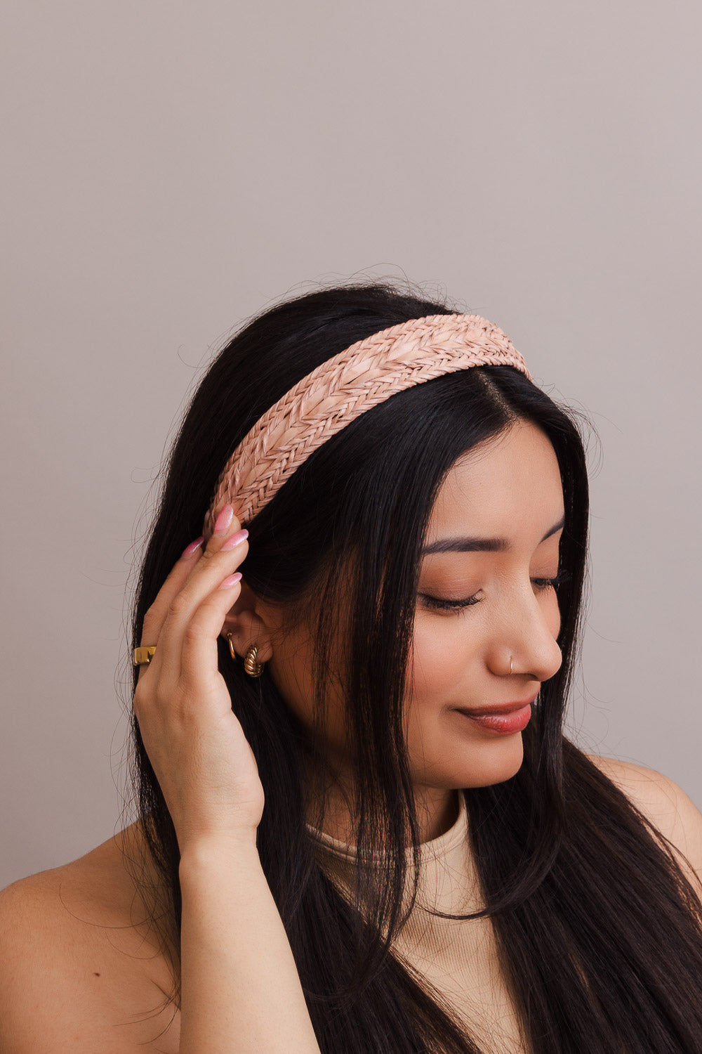 Vegan leather patterned blush headband with polyester design.