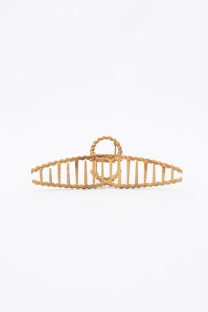 Braided metal hair clip with elegant wood grain finish.