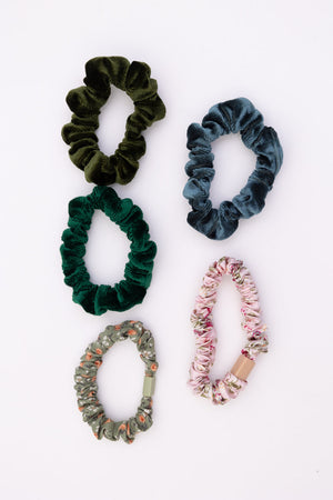 Seasonal floral scrunchies with gentle elastic.