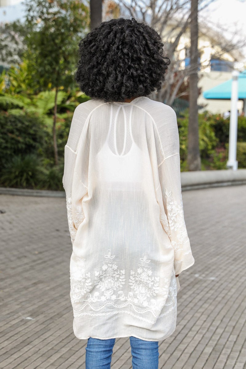 Embroidered cream floral vine kimono with lightweight and stylish design.